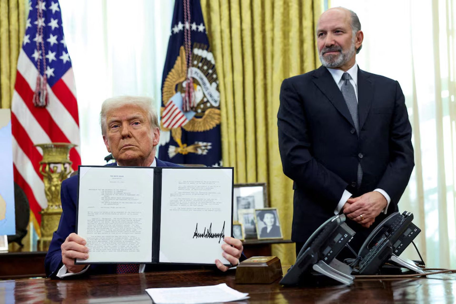 President Donald Trump addresses journalists before signing a decree on healthcare pricing.